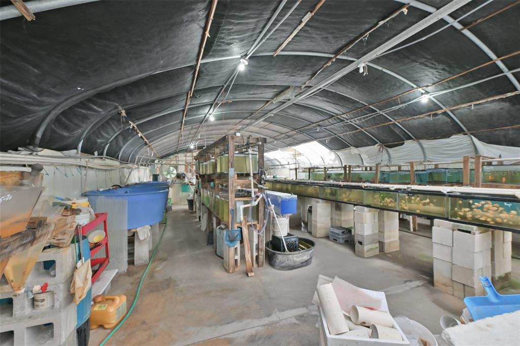 14451 Highland Road Wimauma, FL 33598 - Photo 26 of 80 a view of a storage room with racks