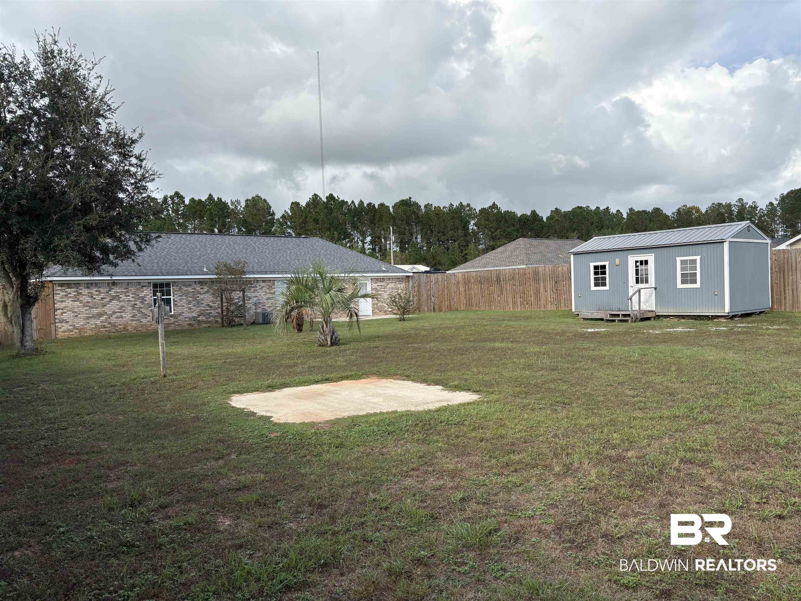 13281 Labradors Run Foley, AL 36535 - Photo 7 of 7 View of yard with an outbuilding and a patio area