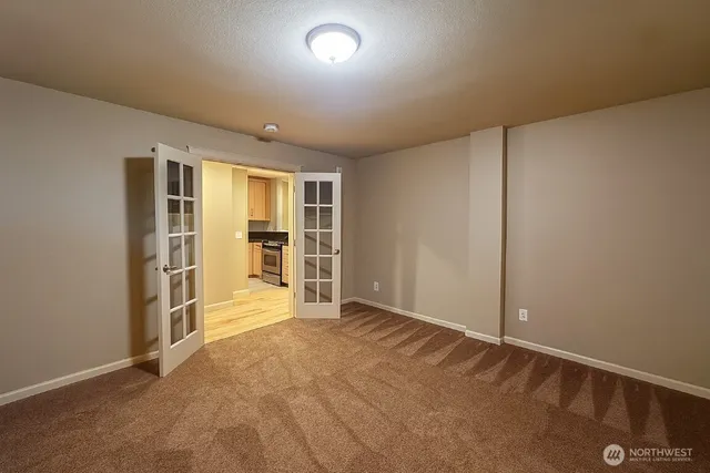 an empty room with a empty space and windows