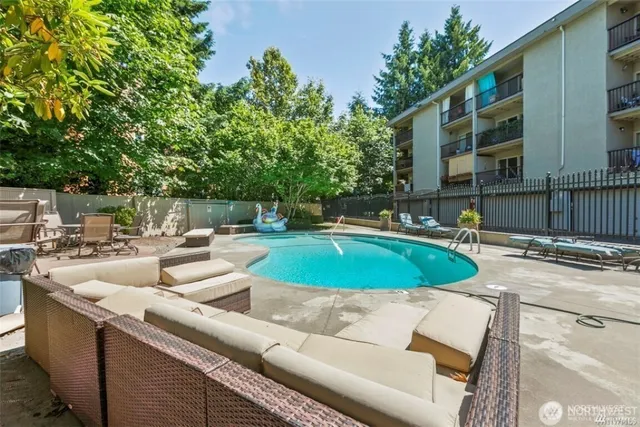 a view of a swimming pool with a patio