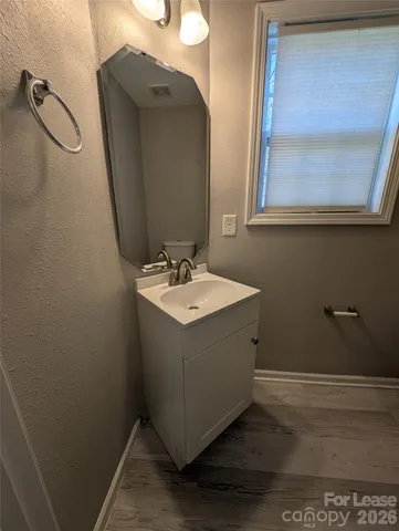 a bathroom with a sink and mirror