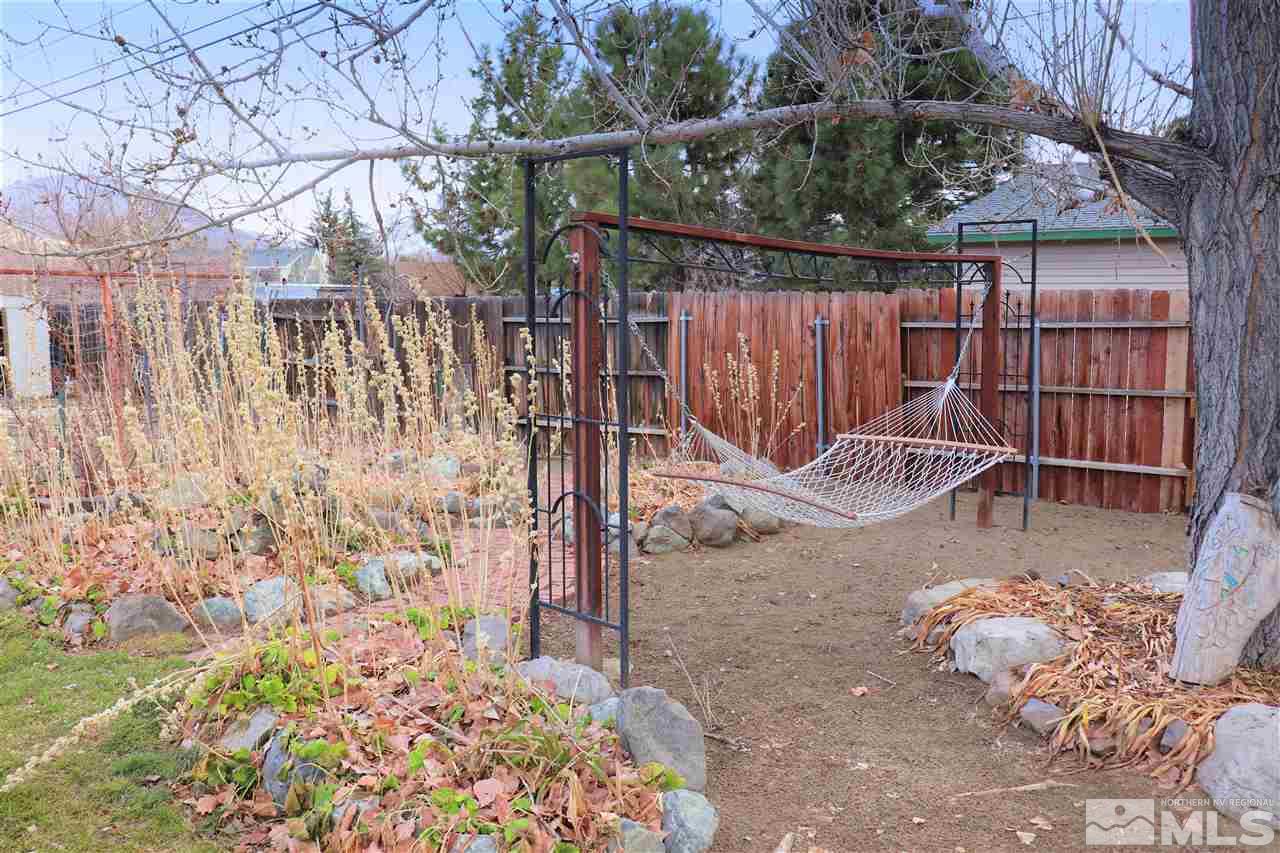 17360 Cold Springs Drive Reno, NV 89508 - Photo 15 of 16 a view of a backyard with a wooden fence