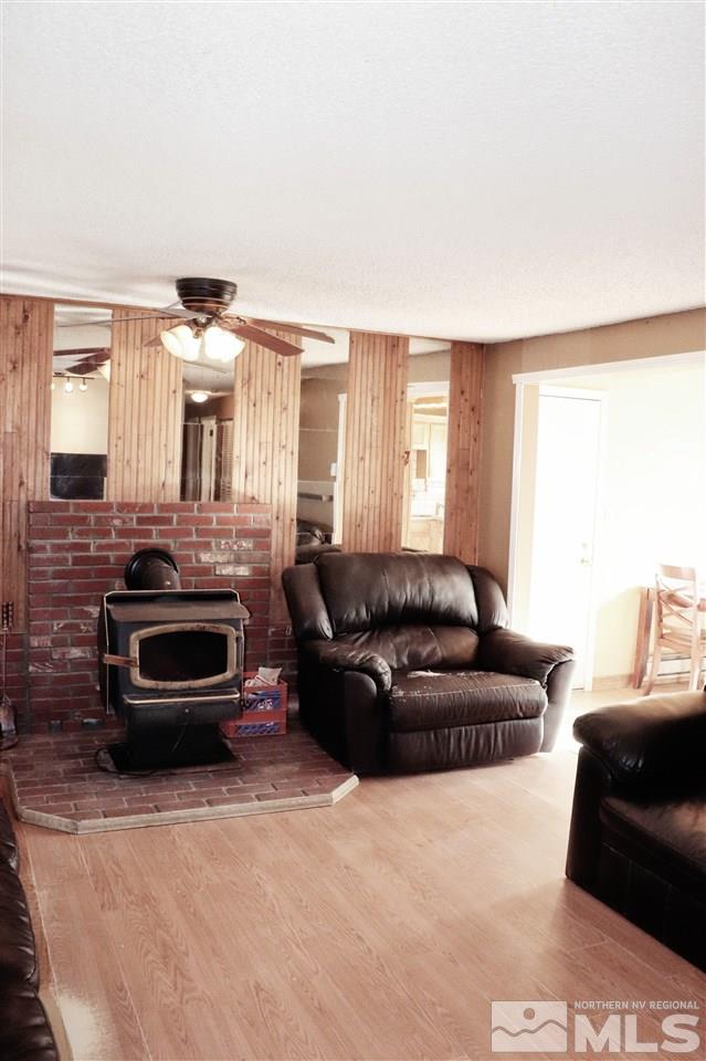 17360 Cold Springs Drive Reno, NV 89508 - Photo 2 of 16 a living room with furniture and a fireplace