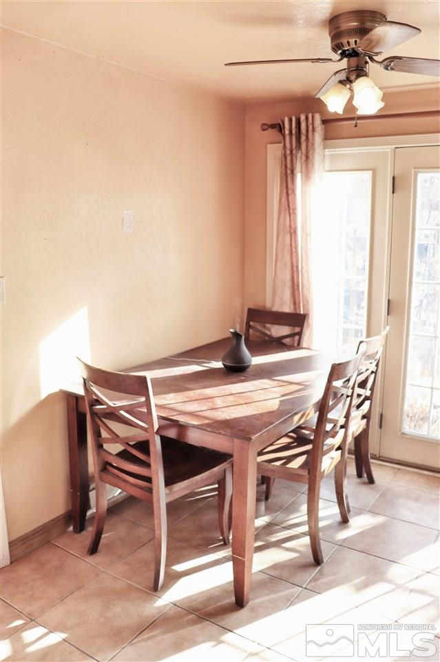 17360 Cold Springs Drive Reno, NV 89508 - Photo 5 of 16 a view of a dining room with furniture and a chandelier