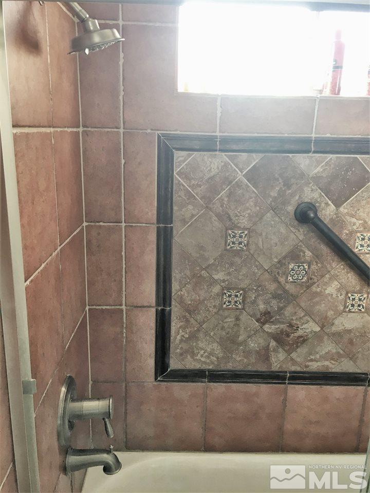 17360 Cold Springs Drive Reno, NV 89508 - Photo 8 of 16 a bathroom with a shower