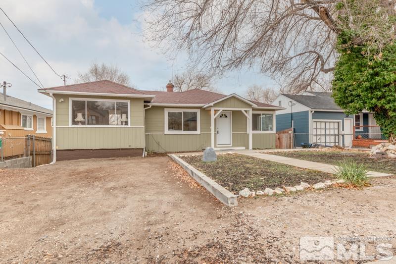 1340 Ralston Street Reno, NV 89503 - Photo 1 of 33 a front view of a house with a garden