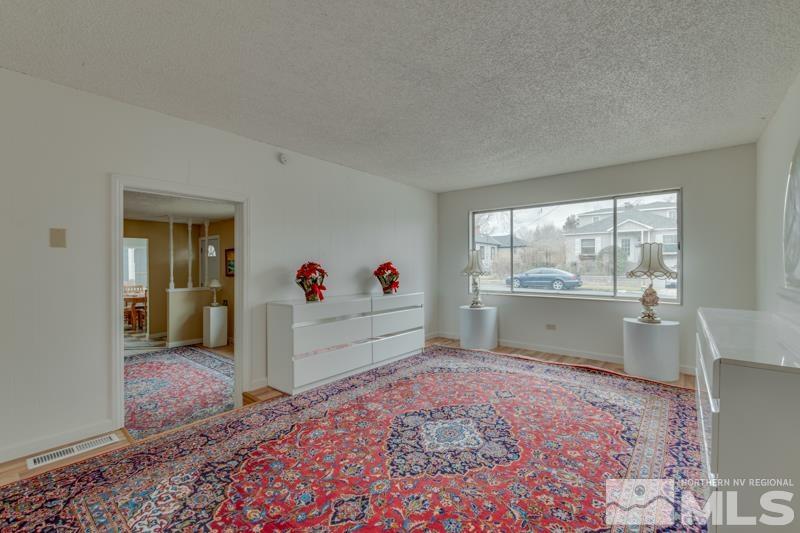 1340 Ralston Street Reno, NV 89503 - Photo 13 of 33 a bed room with a bed and a large window