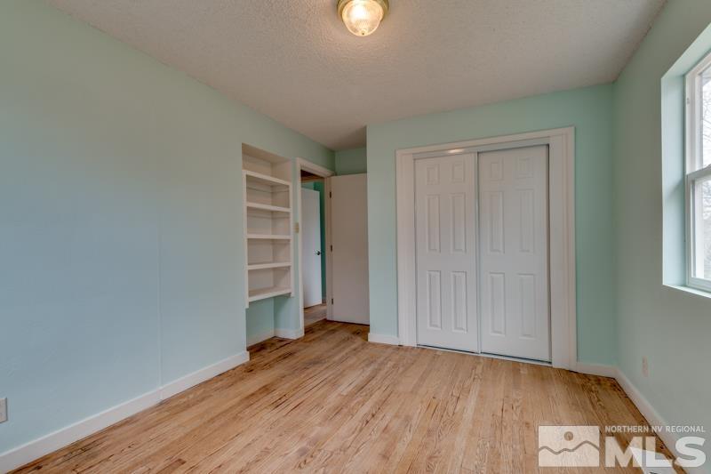 1340 Ralston Street Reno, NV 89503 - Photo 20 of 33 an empty room with wooden floor closet and windows