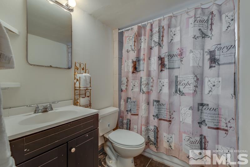 1340 Ralston Street Reno, NV 89503 - Photo 23 of 33 a bathroom with a granite countertop sink toilet and shower