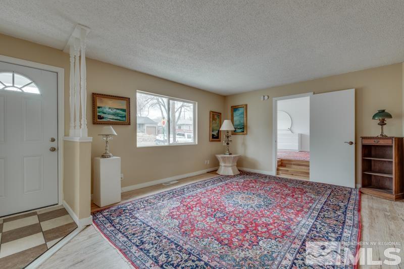 1340 Ralston Street Reno, NV 89503 - Photo 3 of 33 a spacious bedroom with a rug and a window