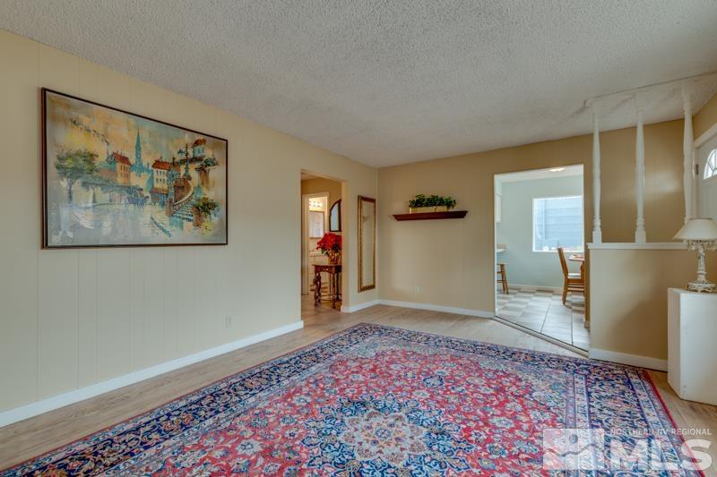 1340 Ralston Street Reno, NV 89503 - Photo 5 of 33 a view of a big room with wooden floor and windows