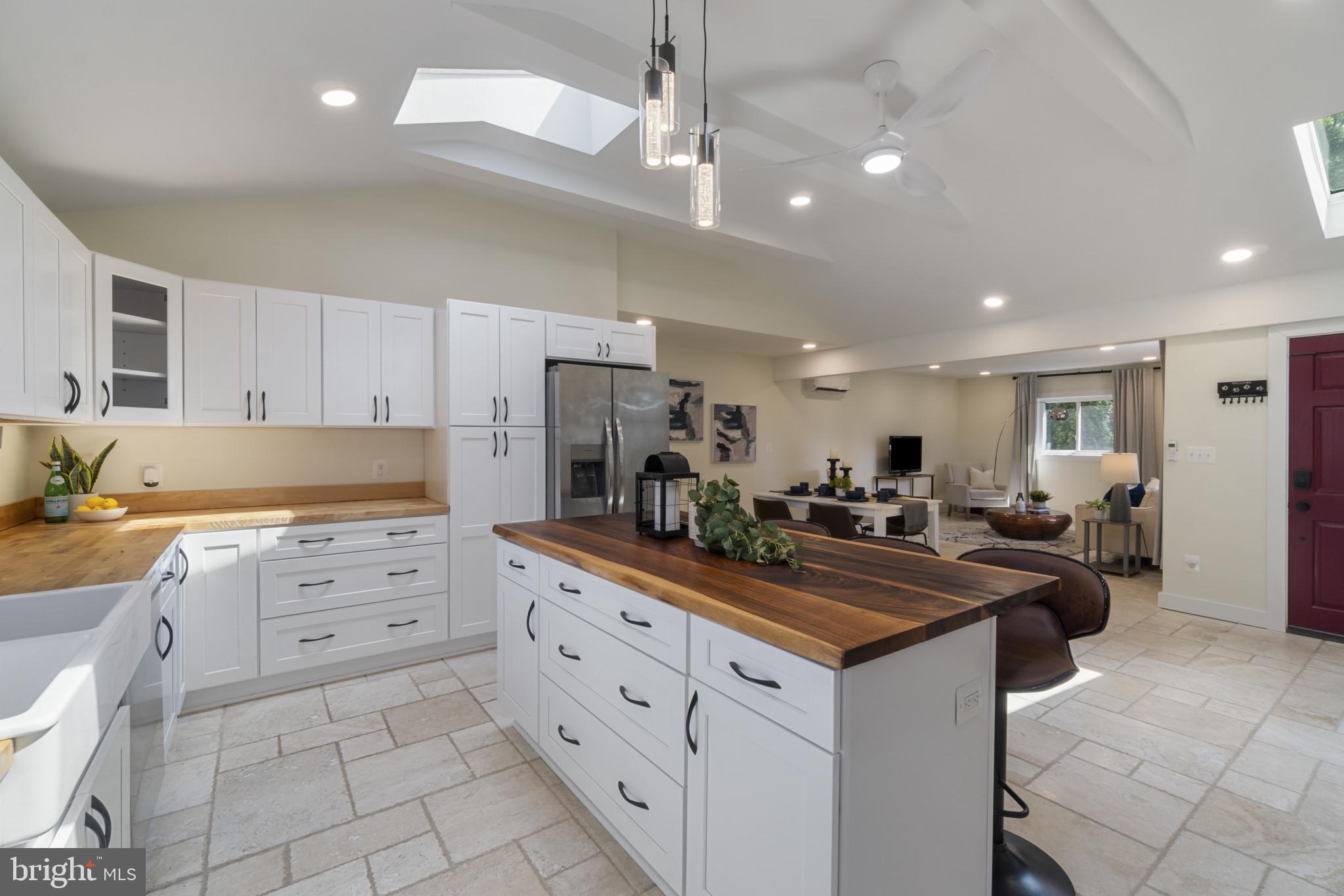 Custom Kitchen with wood counter and bar seating