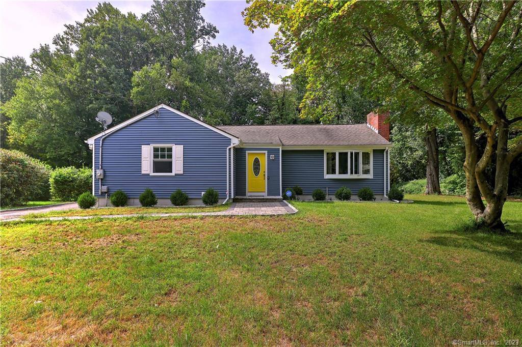 46 Robinwood Road Trumbull, CT 06611 - Photo 1 of 1 a front view of a house with a yard