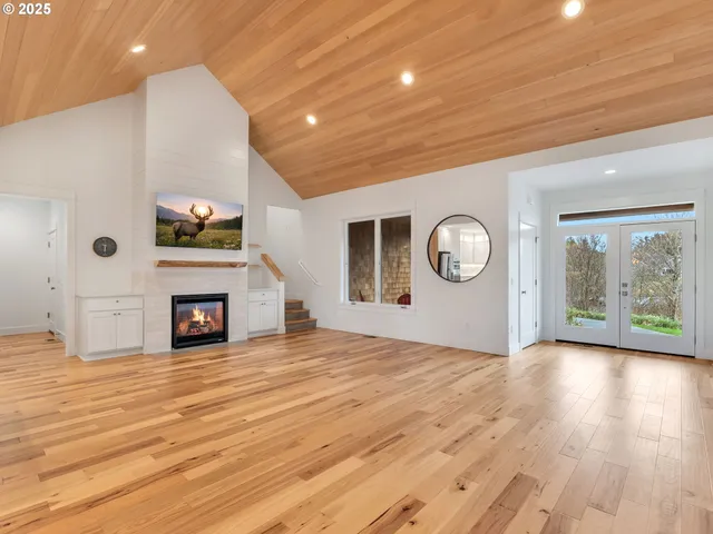 a view of a livingroom with an empty space and a fireplace