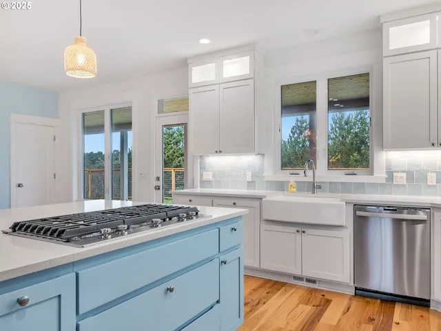 a kitchen with a stove and a sink