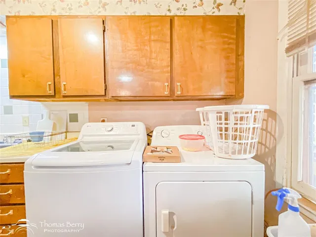 a utility room with dryer and washer