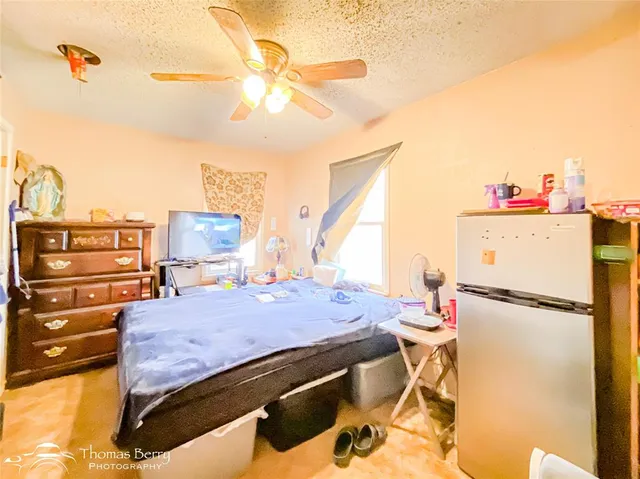 a bed room with a bed and cabinets