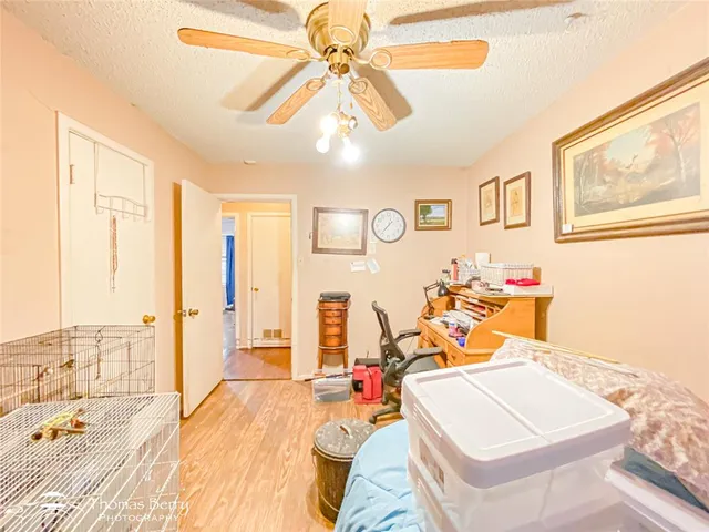 a view of a livingroom with furniture and workspace