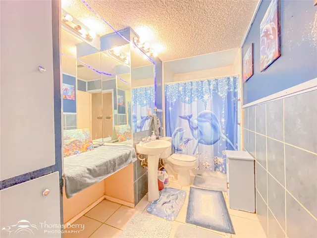 a living room with a large window and furniture