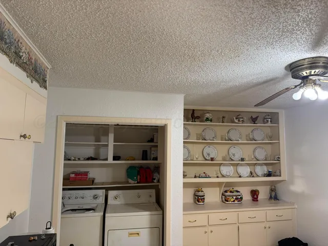 a view of cabinets and shelf with shelf