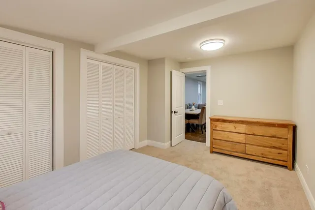 a bedroom with a bed and a cabinets