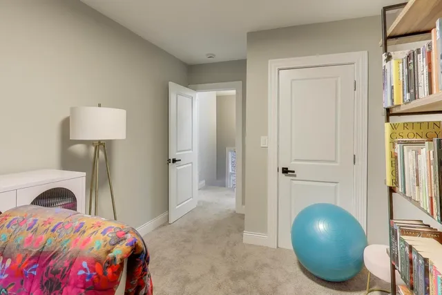 a bedroom with a bed and a table