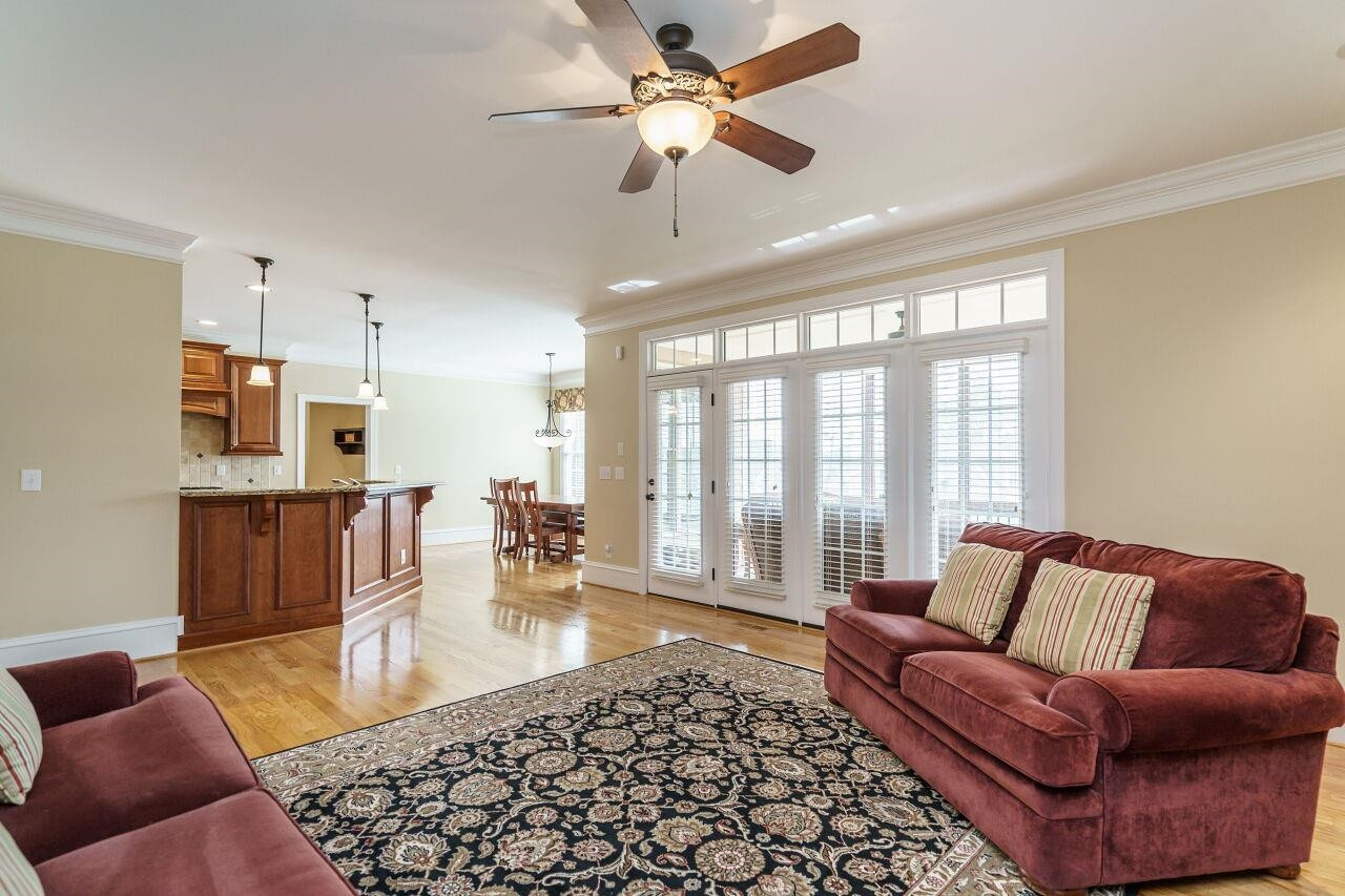 5327 Landguard Drive Raleigh, NC 27613 - Photo 17 of 45 Spacious living room with gas burning fireplace, built in cabinets and shelving and open view to the screened porch! Living Room