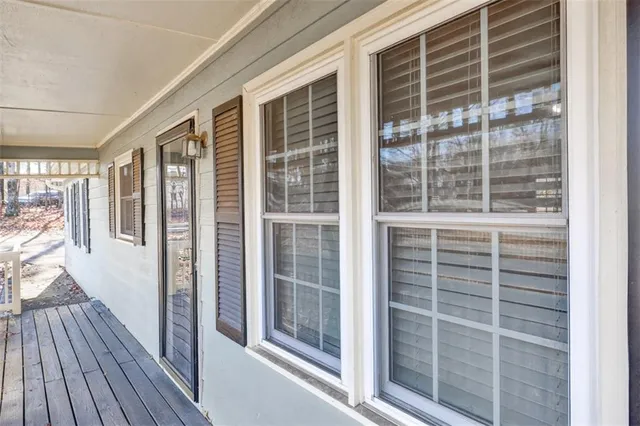 a view of front door with wooden floor