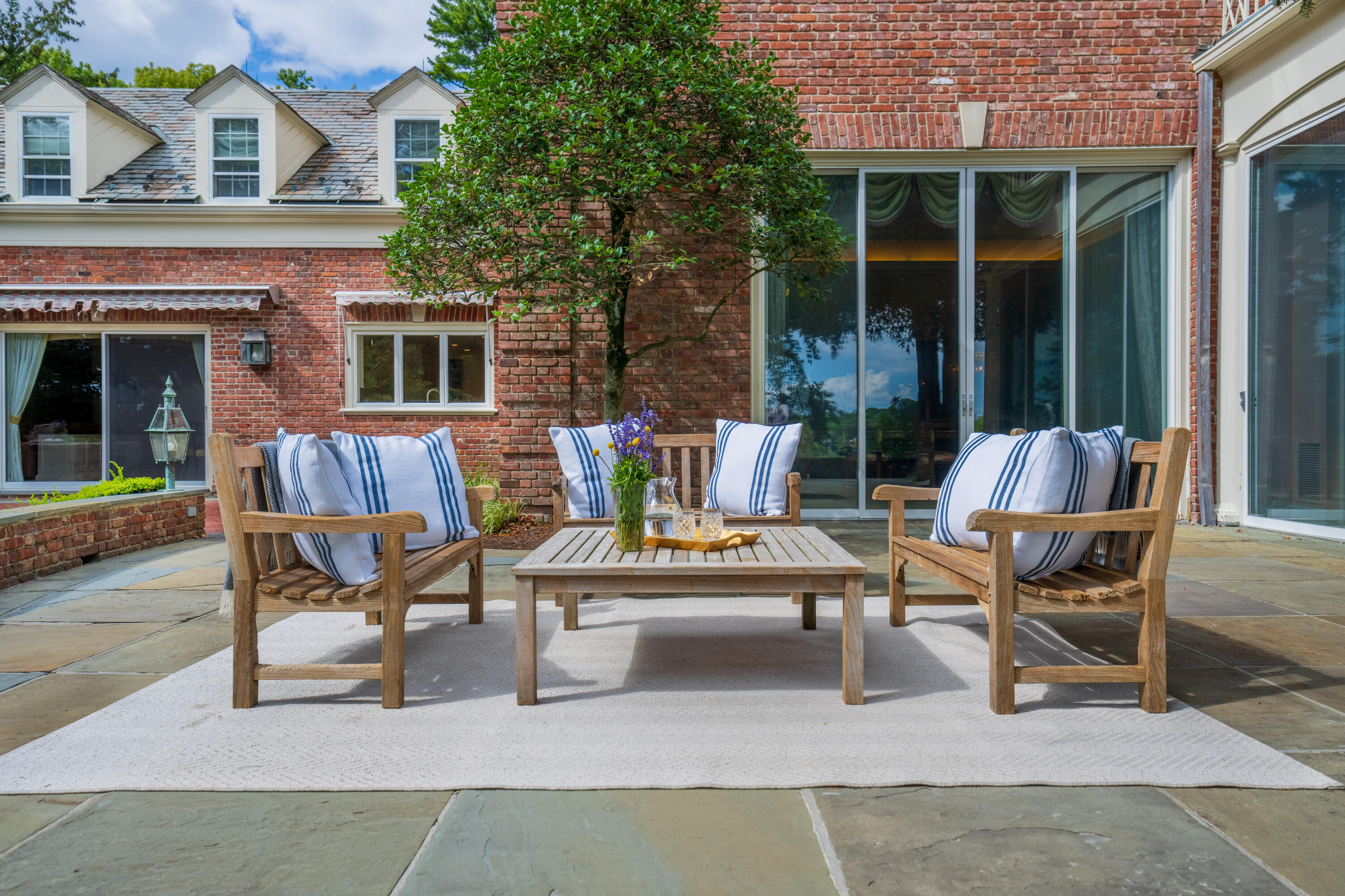 1 Runkenhage Road Darien, CT 06820 - Photo 22 of 33 a view of a house with a patio and a yard