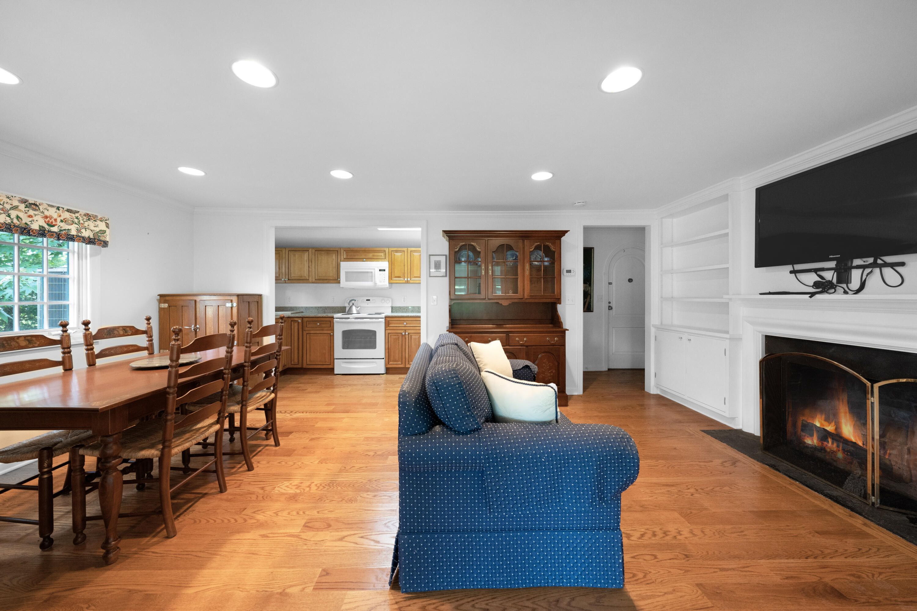 1 Runkenhage Road Darien, CT 06820 - Photo 23 of 33 a living room with fireplace furniture and a flat screen tv