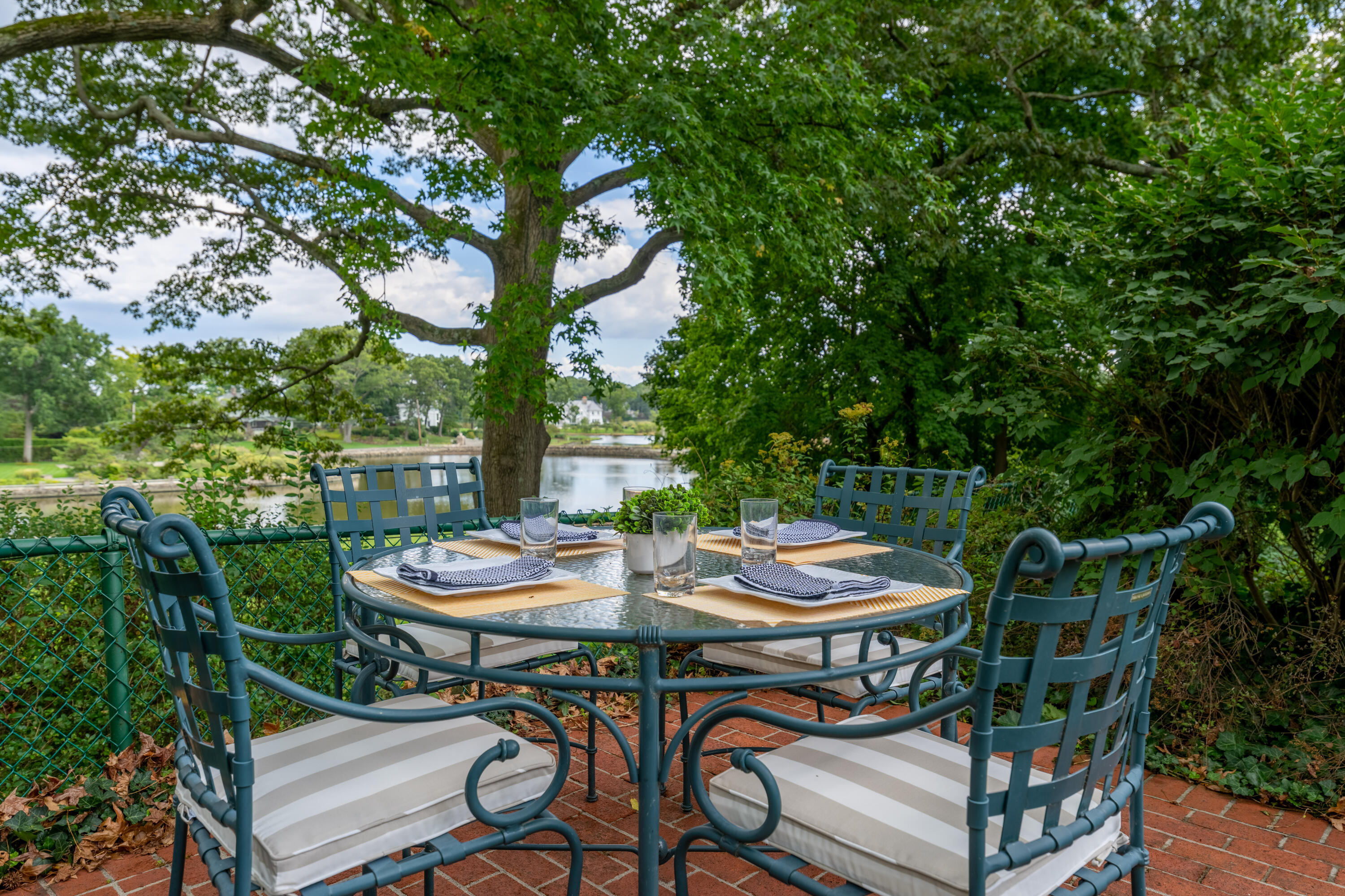 1 Runkenhage Road Darien, CT 06820 - Photo 25 of 33 a backyard of a house with barbeque oven and outdoor seating