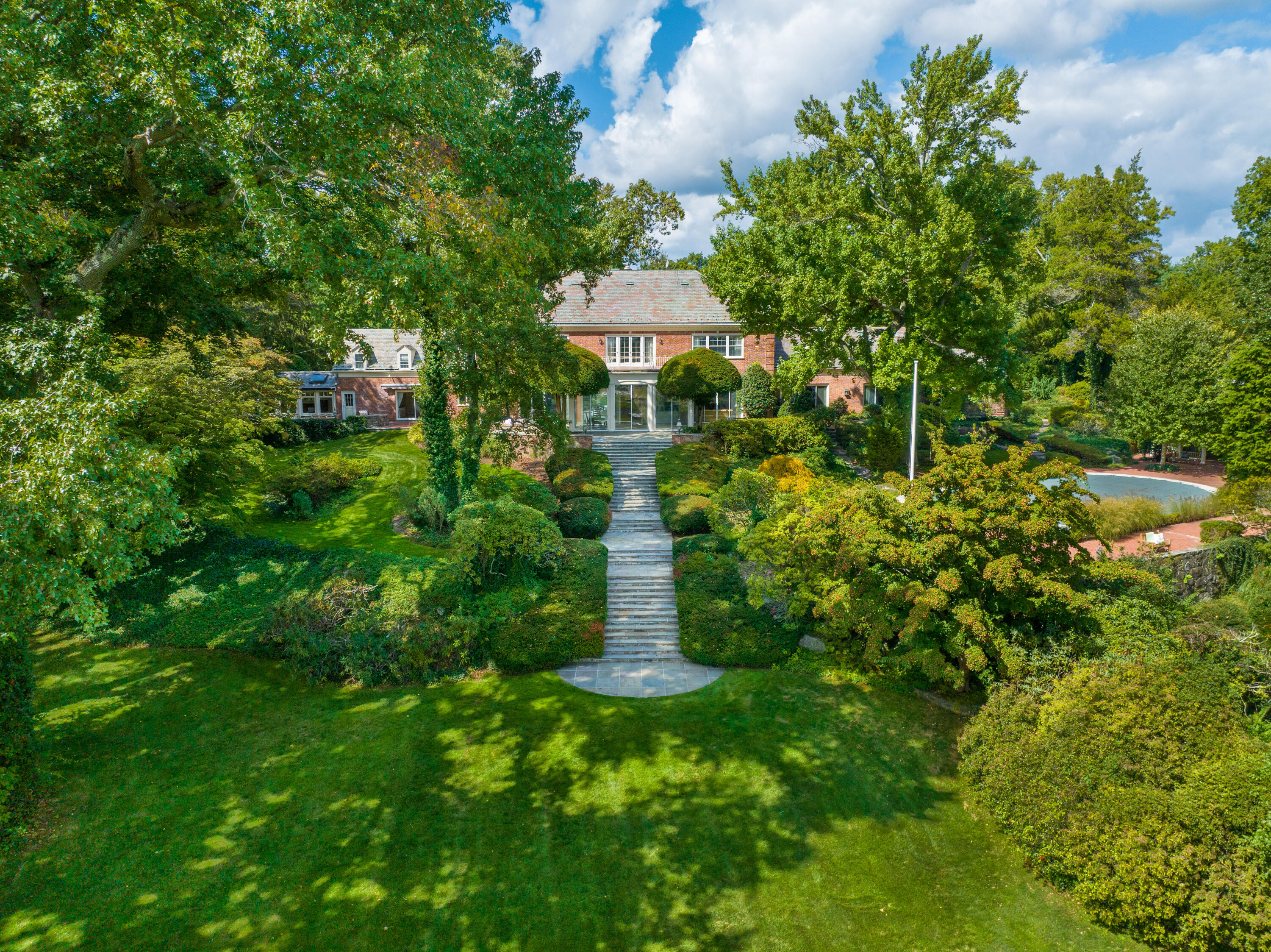 1 Runkenhage Road Darien, CT 06820 - Photo 3 of 33 a view of a garden with a table and plants