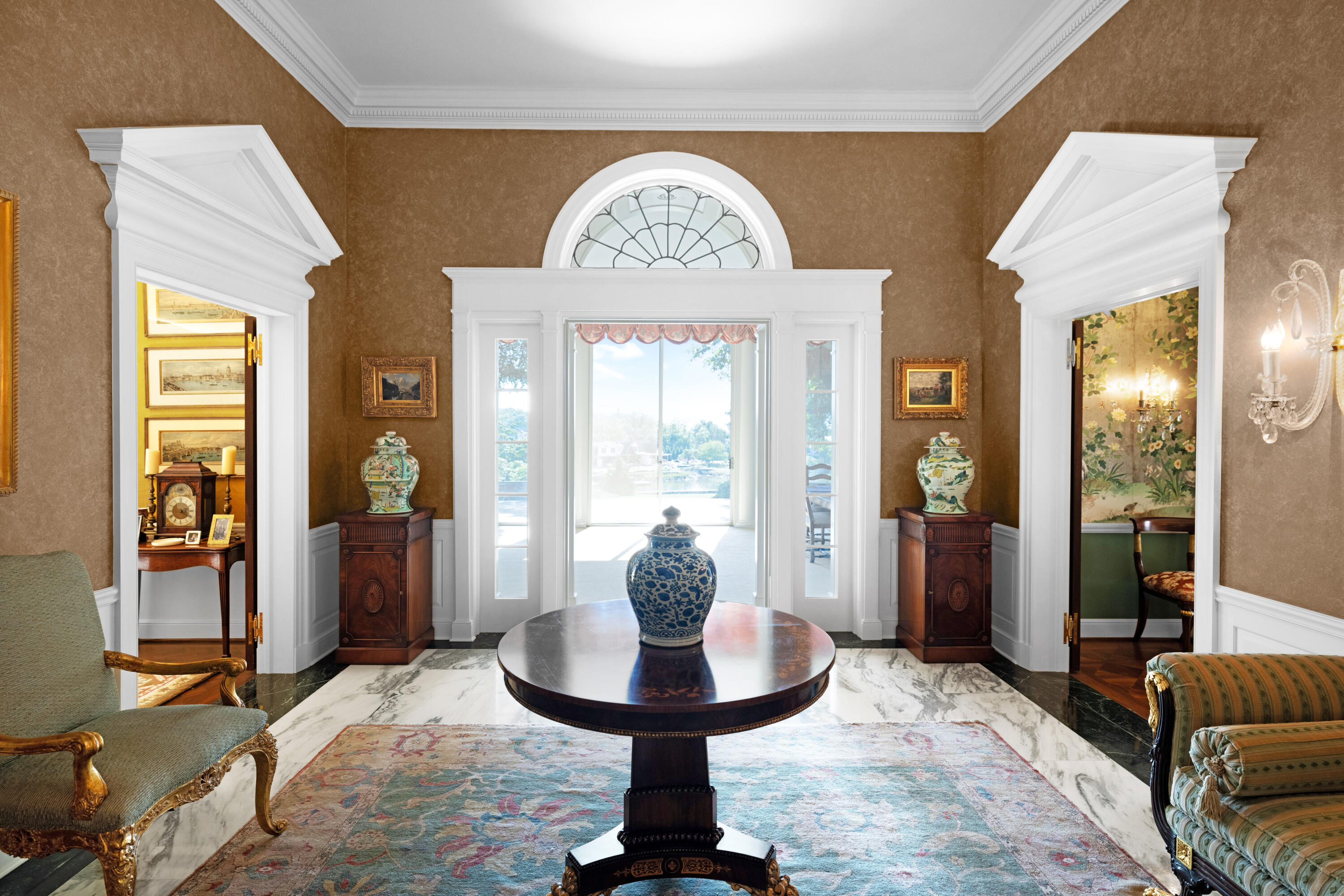 1 Runkenhage Road Darien, CT 06820 - Photo 8 of 33 a living room with furniture a fireplace and a chandelier