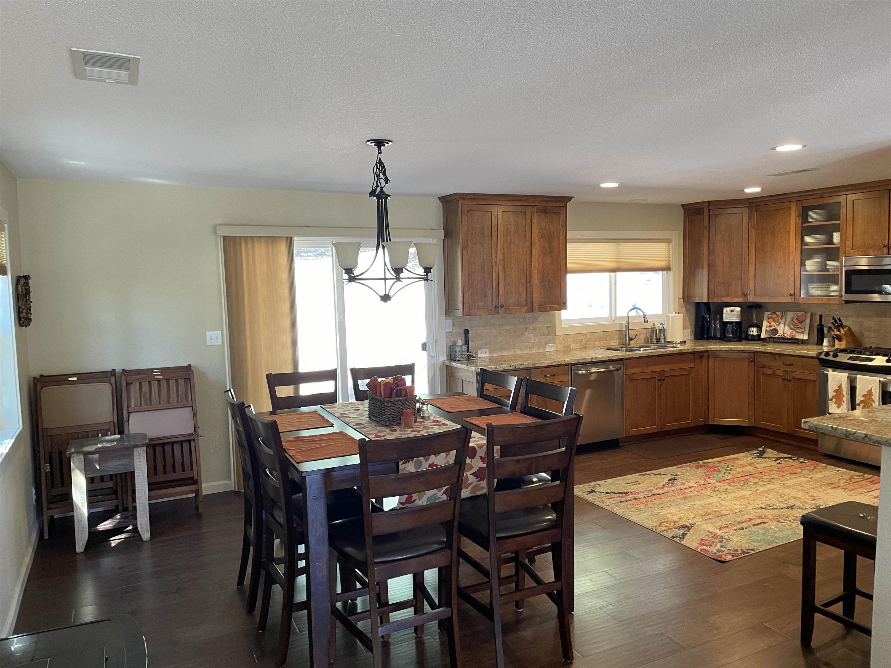 831 Timber Ridge Road Lake Almanor, CA 96137 - Photo 11 of 36 a large kitchen with a table and chairs
