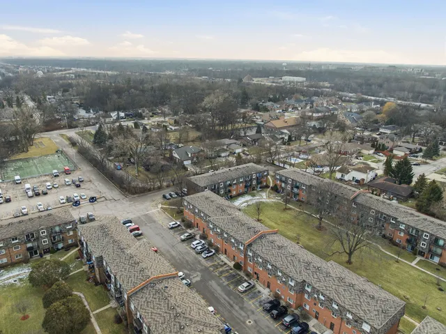 an aerial view of a residential houses with outdoor space