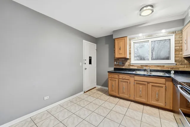 a spacious bathroom with a sink a mirror and a bathtub