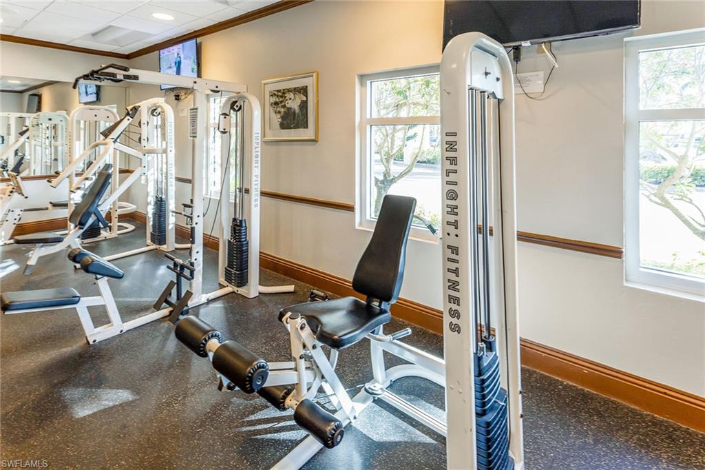 1075 Foxfire Lane, Unit 103 Naples, FL 34104 - Photo 18 of 20 a view of a room with gym equipment