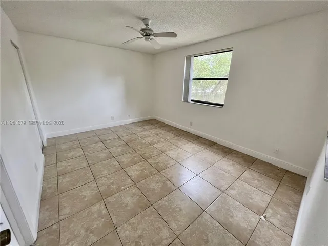 a view of empty room with windows
