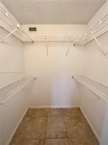 a view of a room with racks on the wall