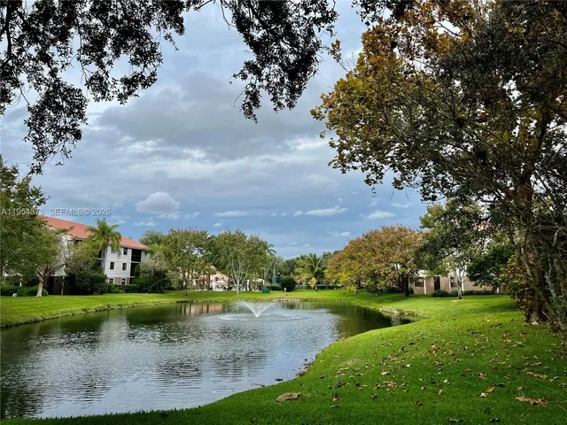 a view of a lake with houses in background