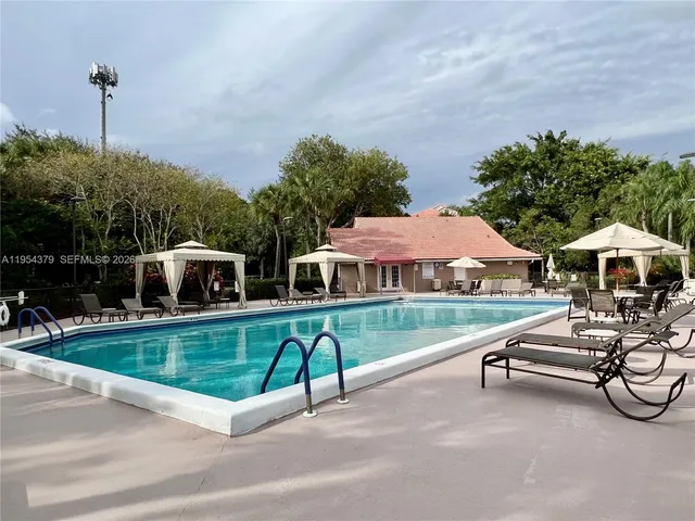 a view of a house with porch and furniture