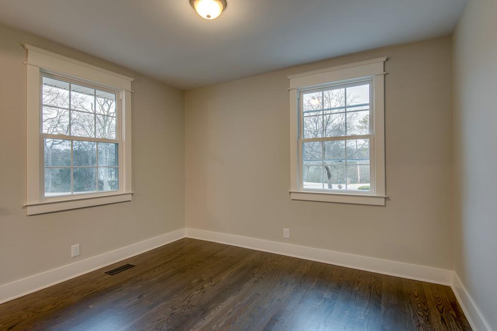 1200 Davidson Road Nashville, TN 37205 - Photo 20 of 30 an empty room with wooden floor and windows