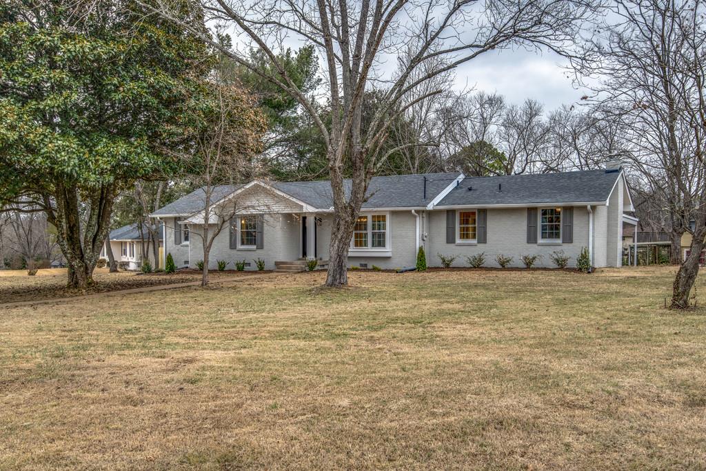 1200 Davidson Road Nashville, TN 37205 - Photo 2 of 30 a front view of a house with a garden
