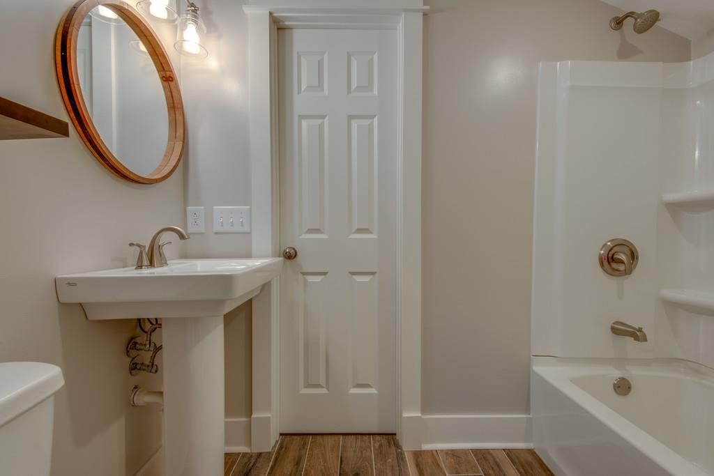 1200 Davidson Road Nashville, TN 37205 - Photo 21 of 30 a bathroom with a sink a toilet and a bathtub