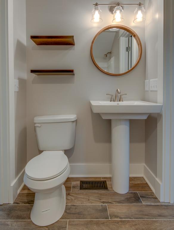 1200 Davidson Road Nashville, TN 37205 - Photo 22 of 30 a bathroom with a toilet sink and mirror