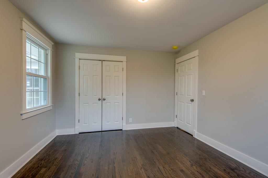 1200 Davidson Road Nashville, TN 37205 - Photo 24 of 30 a view of an empty room with wooden floor and a window