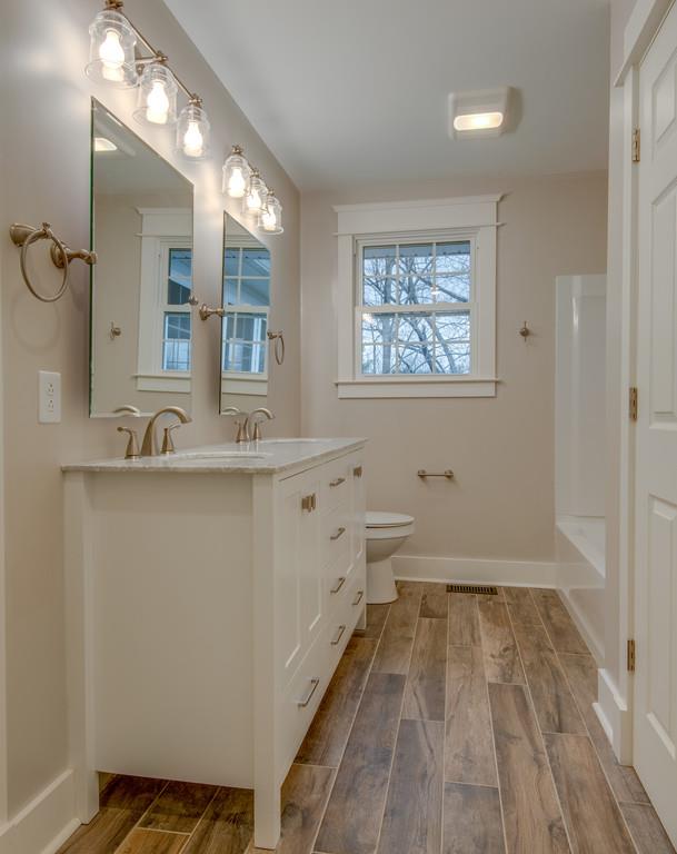 1200 Davidson Road Nashville, TN 37205 - Photo 25 of 30 a bathroom with a sink a mirror and a bathtub