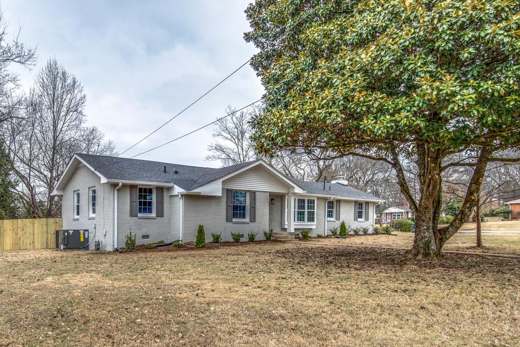 1200 Davidson Road Nashville, TN 37205 - Photo 3 of 30 a front view of a house with a garden