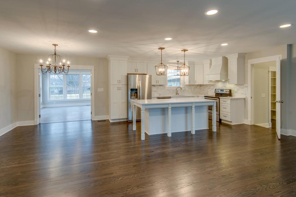 1200 Davidson Road Nashville, TN 37205 - Photo 5 of 30 a open kitchen with white cabinets and stainless steel appliances
