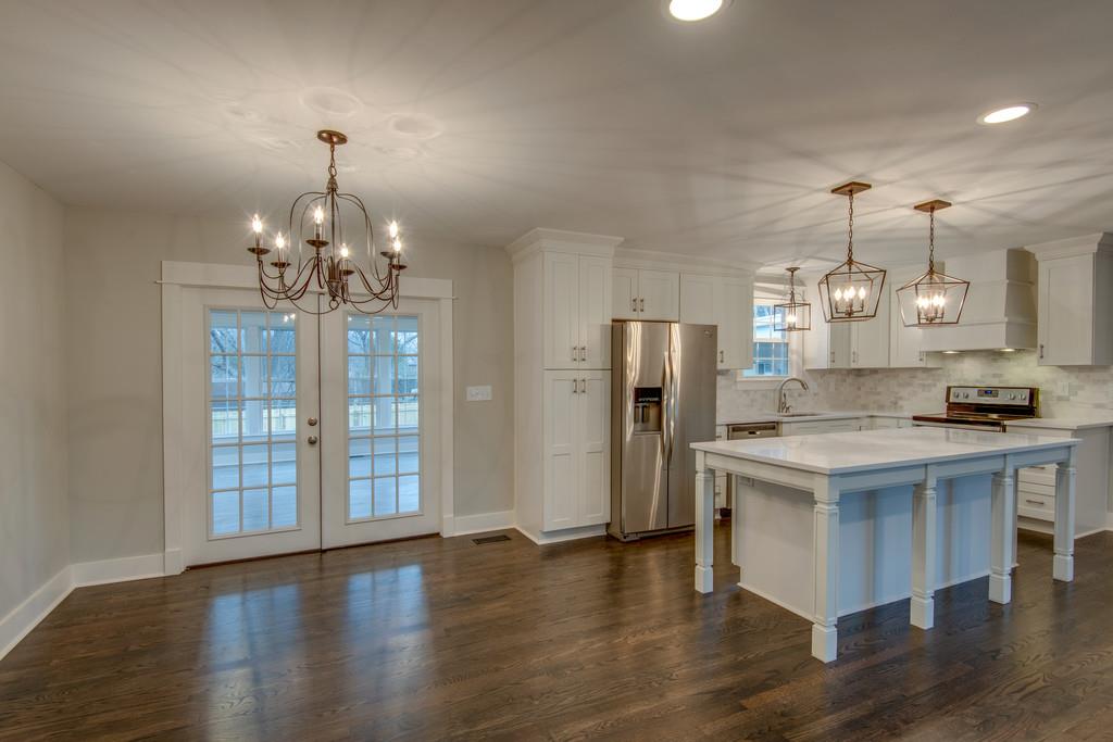 1200 Davidson Road Nashville, TN 37205 - Photo 7 of 30 a kitchen with stainless steel appliances a chandelier and refrigerator